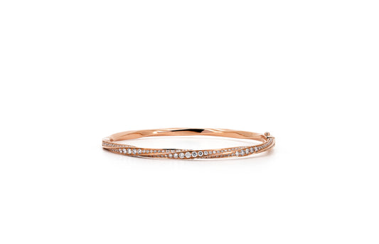 Spiral pave bangle in rose gold