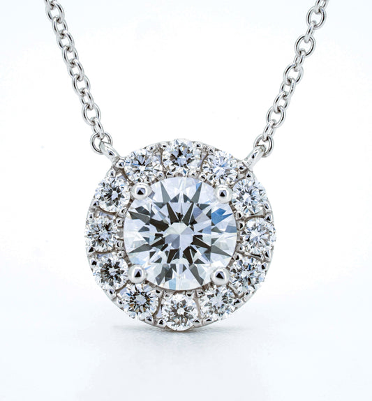 Halo solitaire necklace RD 0.79 D VS1 IGI in white gold