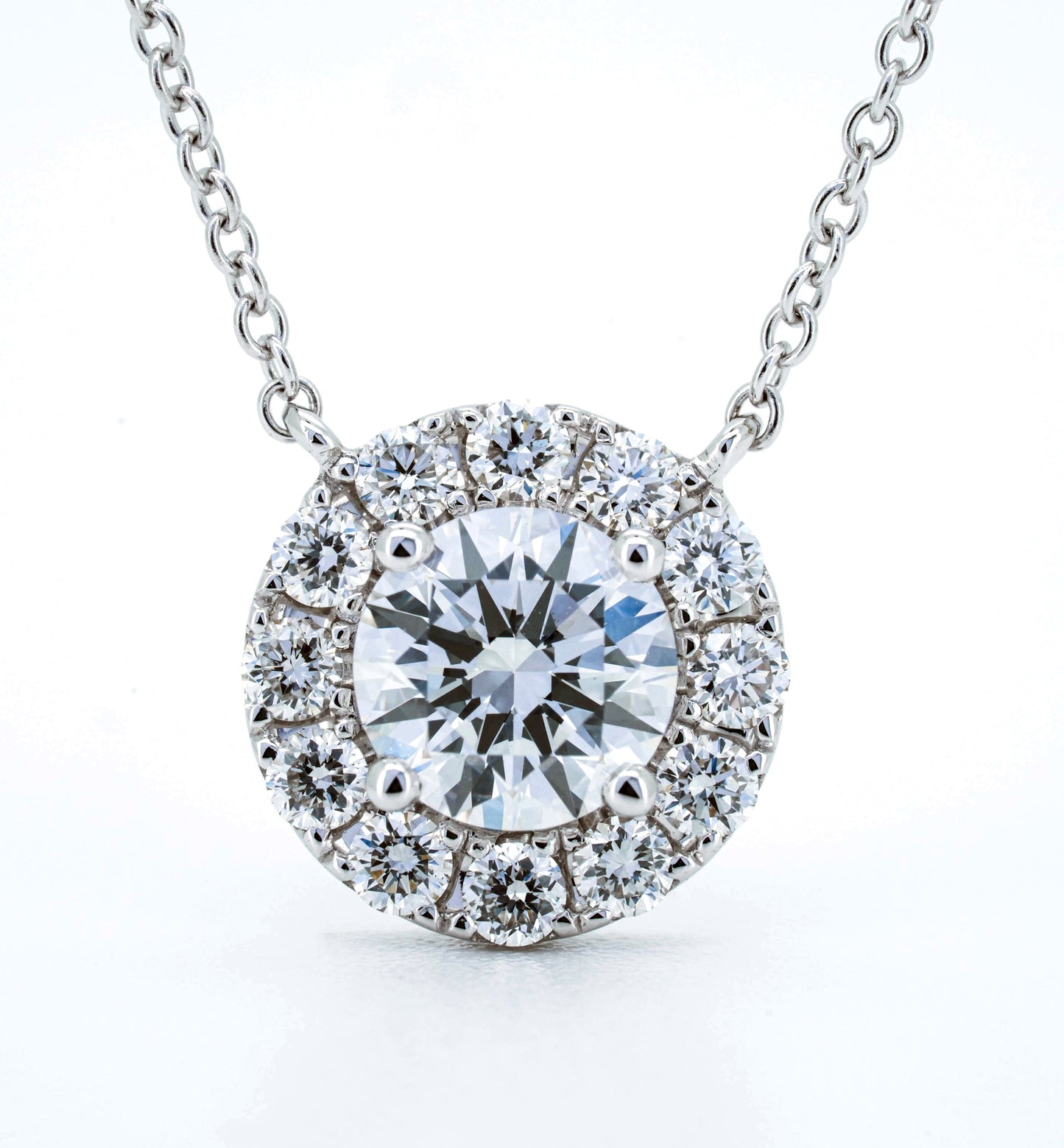 Halo solitaire necklace RD 0.78 D VS1 IGI in white gold